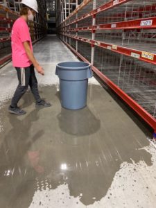 Cleaning floors at warehouse