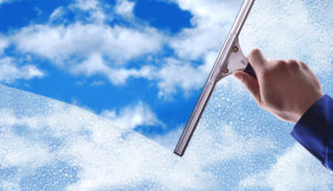 Window cleaning services with blue skies